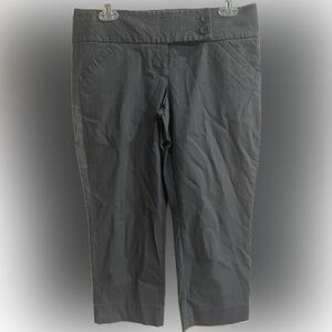 The Limited extra stretch black pin stripe capris! Super cute button detail.